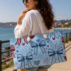 Woman holding a tote bag with decorative patterns by the beach