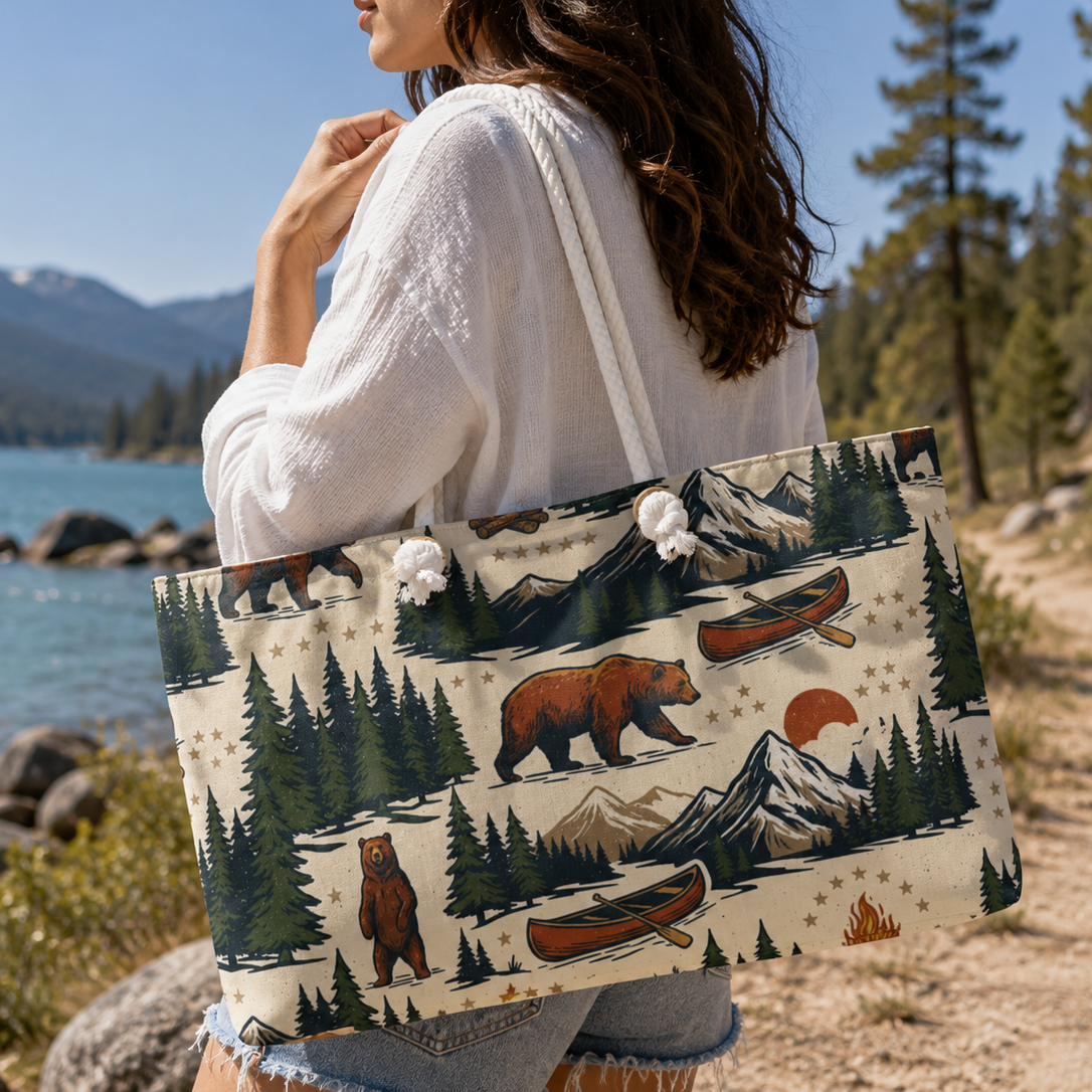 Person holding a tote bag with nature design by a lake